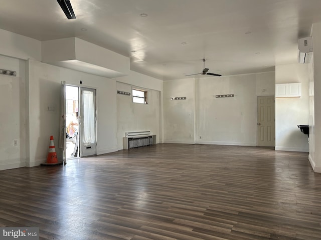 interior space with ceiling fan and dark hardwood / wood-style flooring