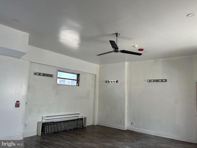 unfurnished room featuring dark hardwood / wood-style flooring and ceiling fan