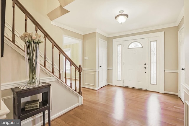 foyer entrance with stairway and plenty of natural light