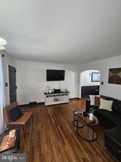 living room with dark wood-type flooring