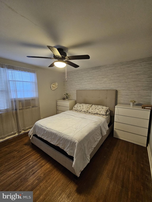 bedroom featuring dark hardwood / wood-style floors and ceiling fan