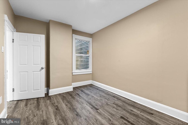 unfurnished bedroom featuring dark hardwood / wood-style flooring