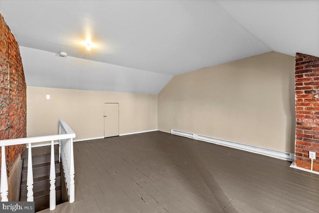 bonus room with lofted ceiling, dark wood-type flooring, and baseboard heating