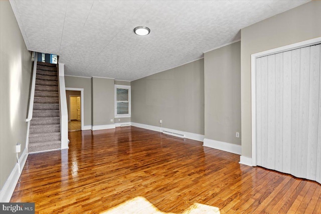 unfurnished living room featuring wood-type flooring