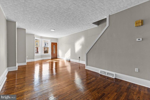 unfurnished living room with wood-type flooring