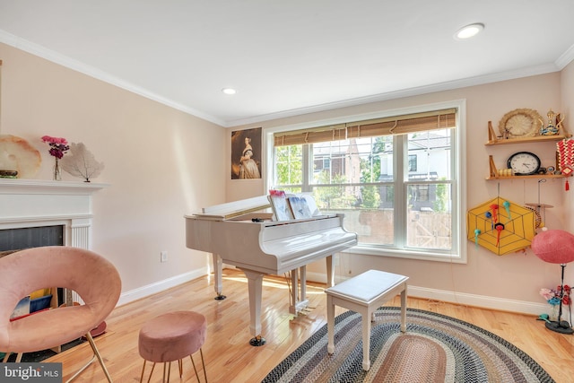 misc room featuring hardwood / wood-style floors and crown molding