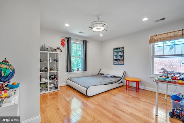 bedroom with hardwood / wood-style floors