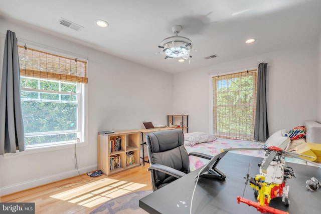 bedroom with light hardwood / wood-style flooring