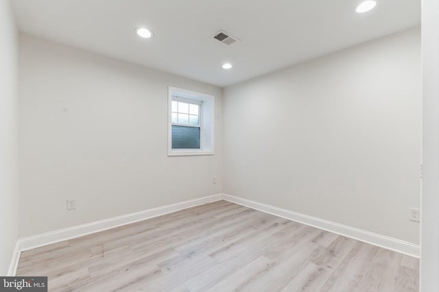 spare room with light wood-type flooring