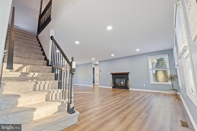 stairway with wood-type flooring