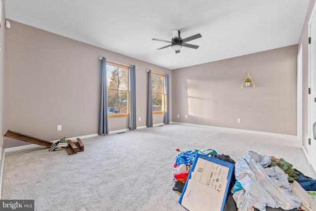 rec room featuring carpet floors and ceiling fan