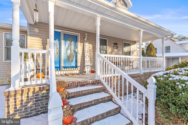 doorway to property with a porch