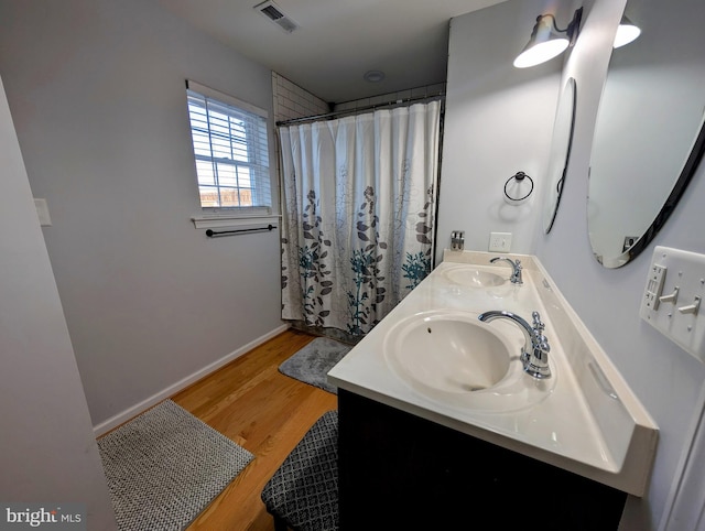 bathroom with vanity, hardwood / wood-style floors, and a shower with shower curtain