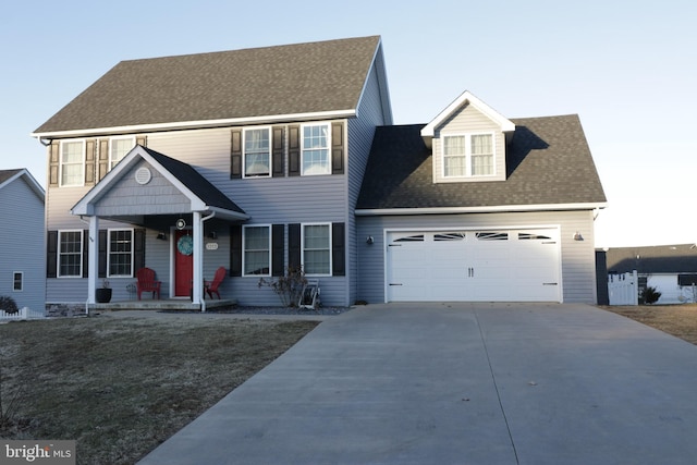 view of front of property with a garage and a porch