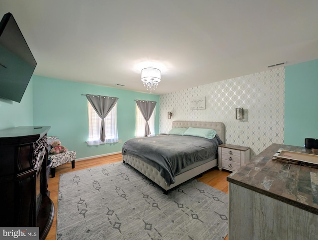 bedroom with light wood-type flooring