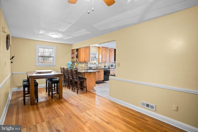 dining area with light wood-type flooring