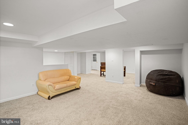 living area featuring carpet