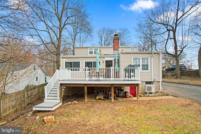 back of property featuring a deck