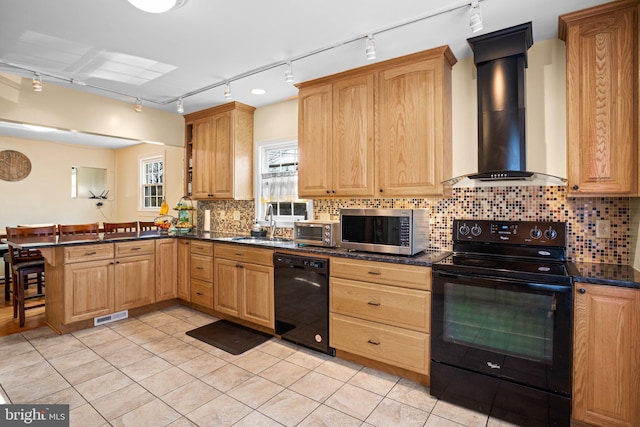 kitchen featuring sink, black appliances, kitchen peninsula, wall chimney range hood, and backsplash