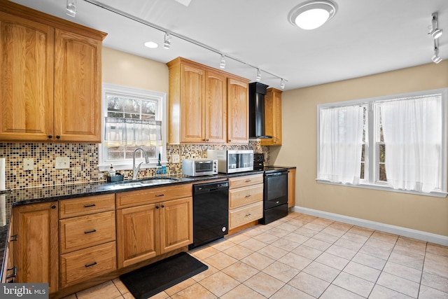 kitchen featuring sink, tasteful backsplash, black appliances, dark stone countertops, and wall chimney range hood