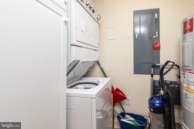 laundry area featuring stacked washer and dryer and electric panel