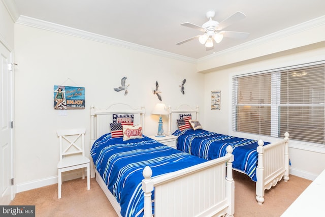 bedroom with crown molding, ceiling fan, and carpet flooring