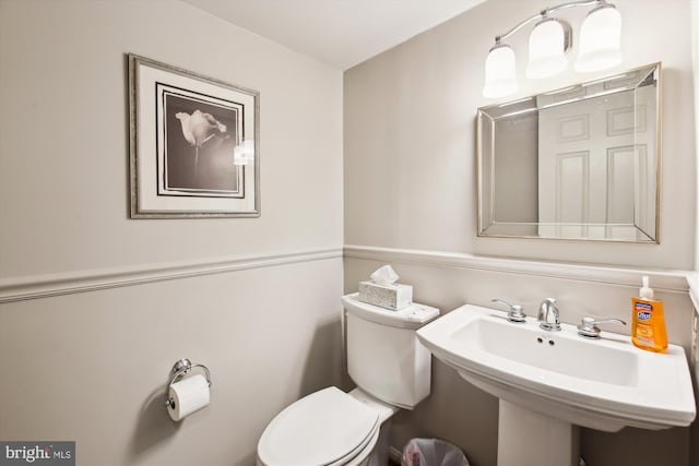 bathroom with sink and toilet