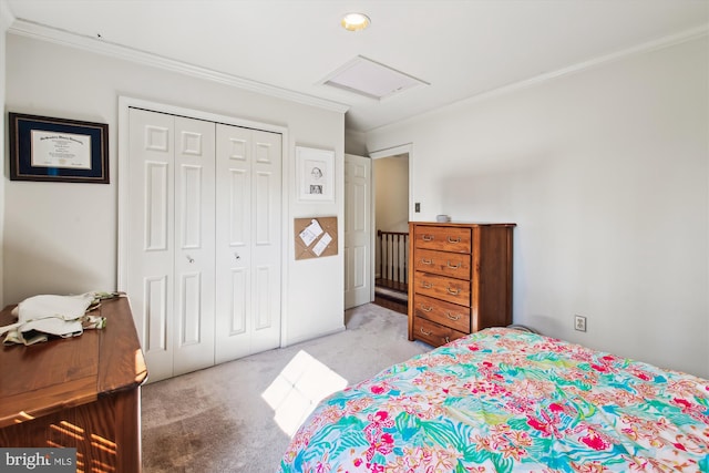 bedroom with crown molding, light carpet, and a closet