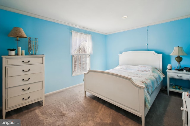 bedroom with dark carpet and ornamental molding