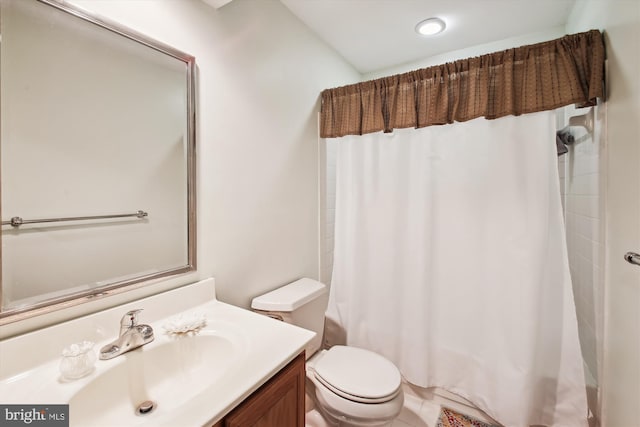 full bathroom with shower / bath combination with curtain, vanity, and toilet