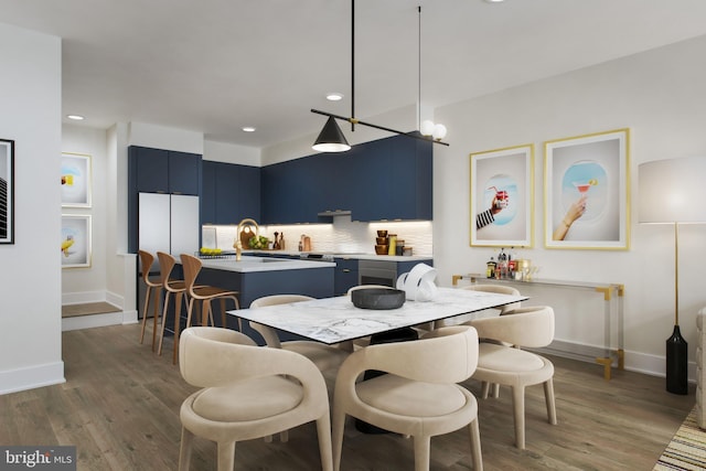 dining room featuring dark hardwood / wood-style floors and sink