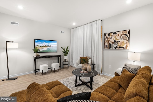 living room with light hardwood / wood-style floors