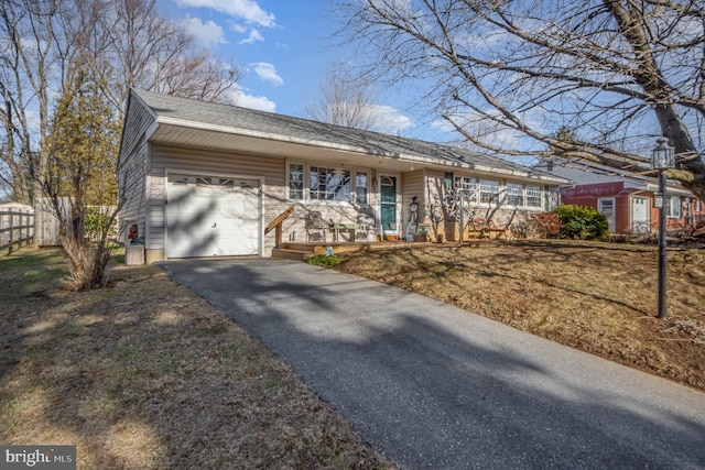 ranch-style house featuring a garage