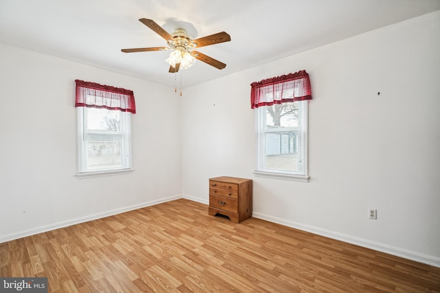 spare room featuring ceiling fan and light wood-type flooring