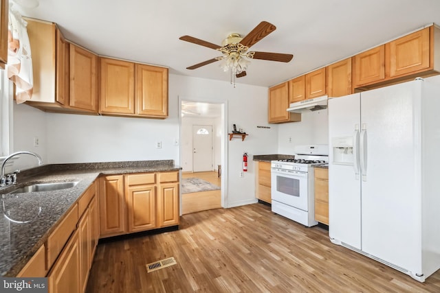 kitchen with ceiling fan, white appliances, light hardwood / wood-style floors, and sink