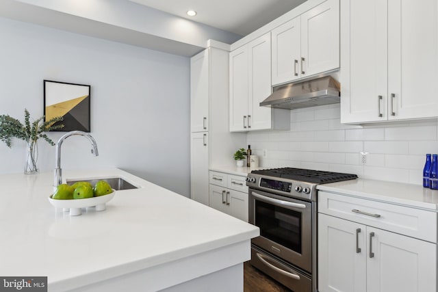 kitchen with white cabinets, sink, and stainless steel gas range