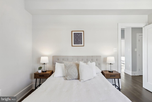 bedroom featuring dark wood-type flooring