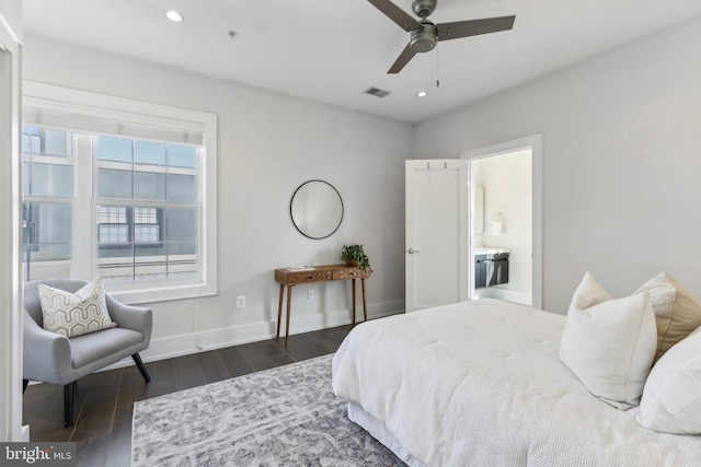 bedroom featuring dark wood-type flooring, ensuite bath, and ceiling fan