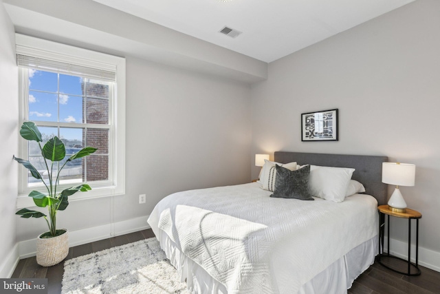 bedroom featuring dark hardwood / wood-style floors