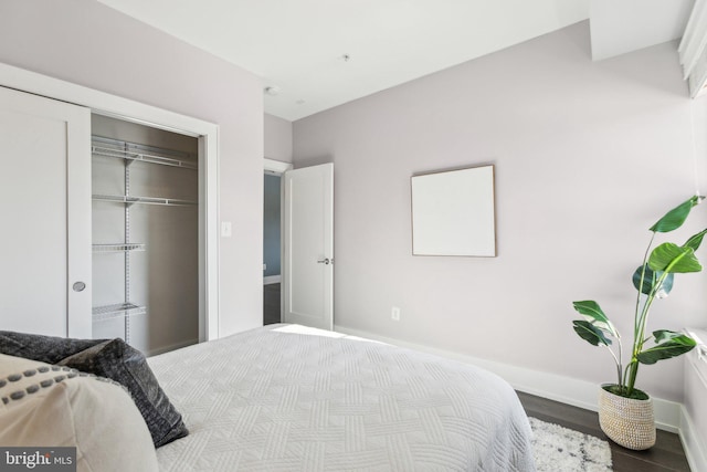 bedroom featuring hardwood / wood-style flooring and a closet