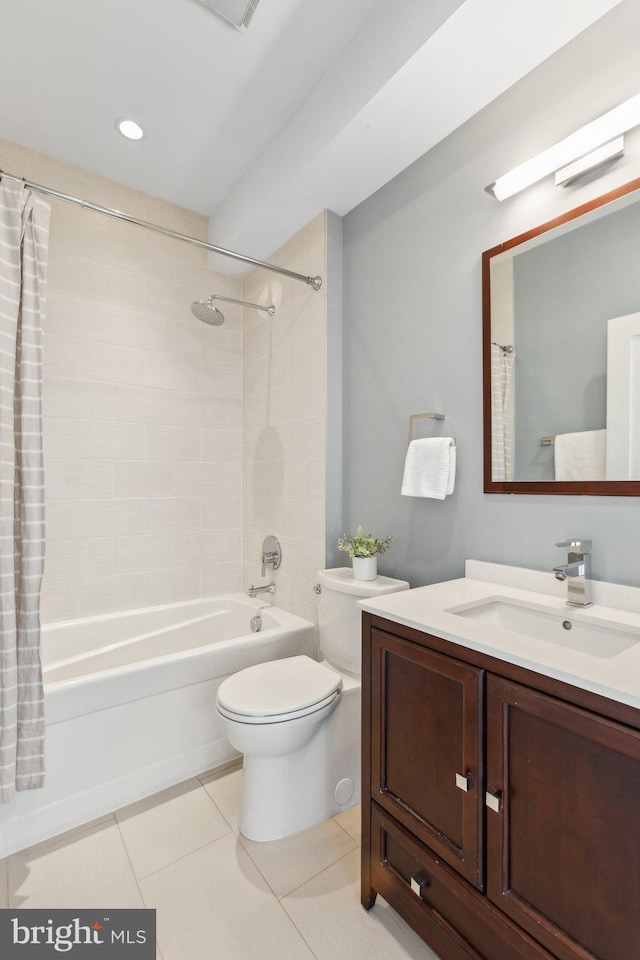 full bathroom with tile patterned flooring, vanity, shower / bathtub combination with curtain, and toilet