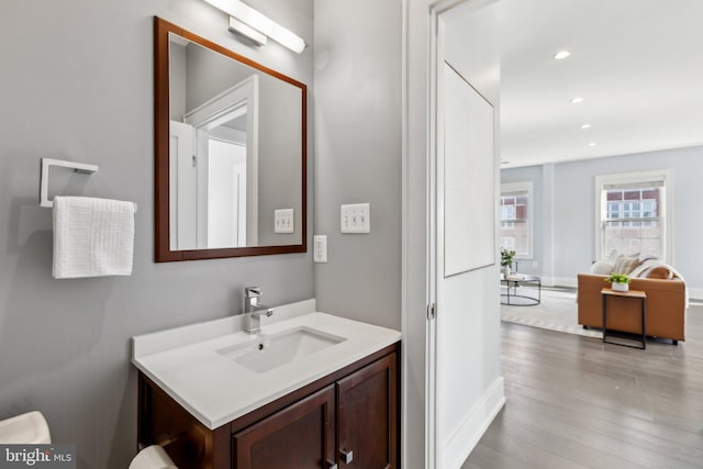 bathroom with vanity and hardwood / wood-style floors