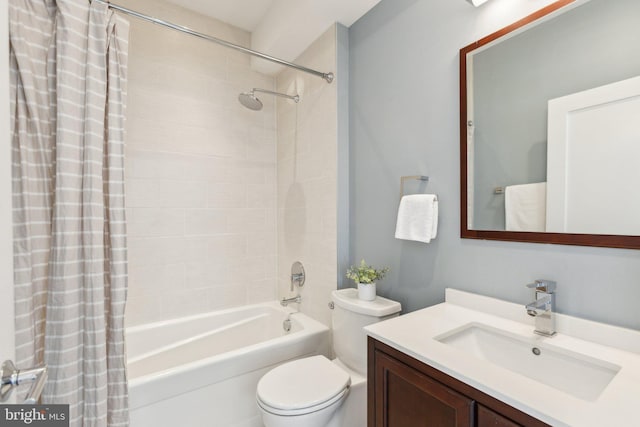 full bathroom featuring vanity, toilet, and shower / bath combo with shower curtain