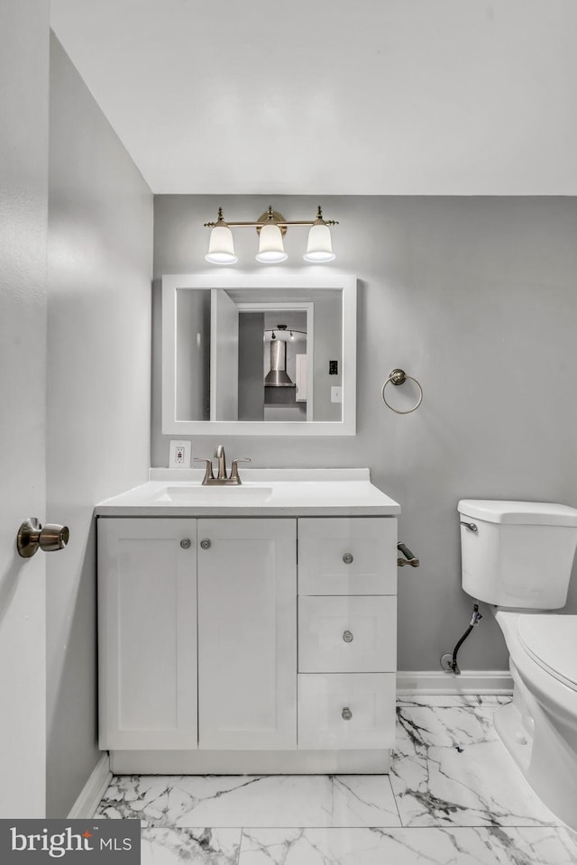 bathroom with vanity and toilet