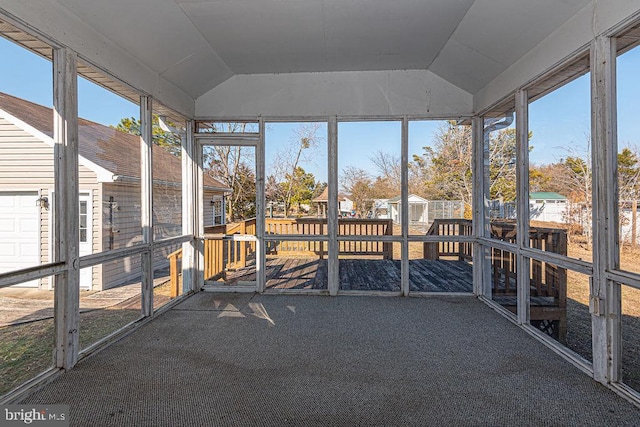 unfurnished sunroom with vaulted ceiling