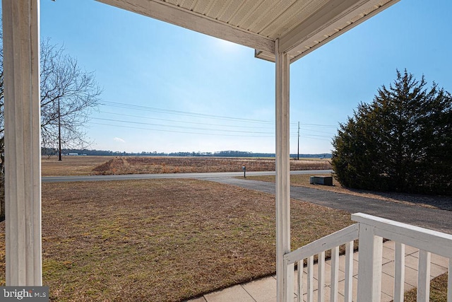 view of yard with a rural view