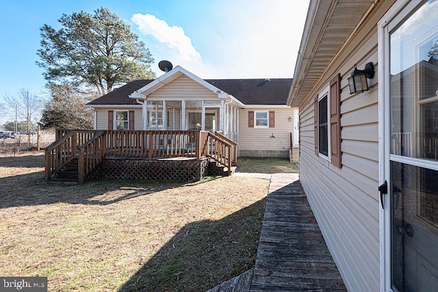 rear view of house with a deck