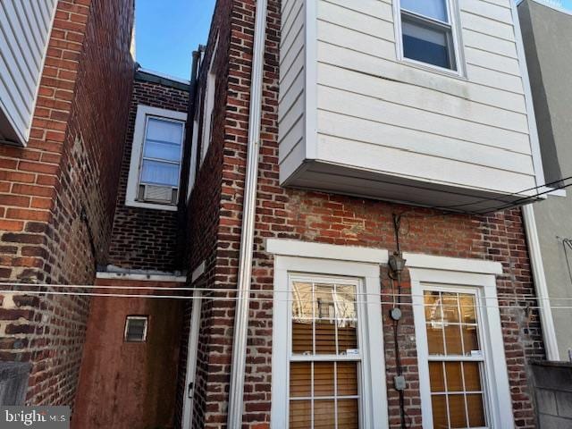 view of side of property with brick siding