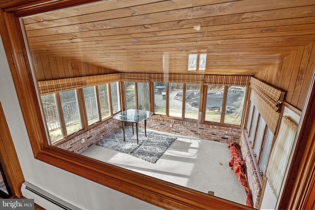 unfurnished sunroom featuring lofted ceiling, a healthy amount of sunlight, and wooden ceiling