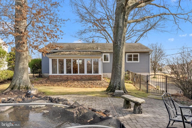 rear view of property with a patio